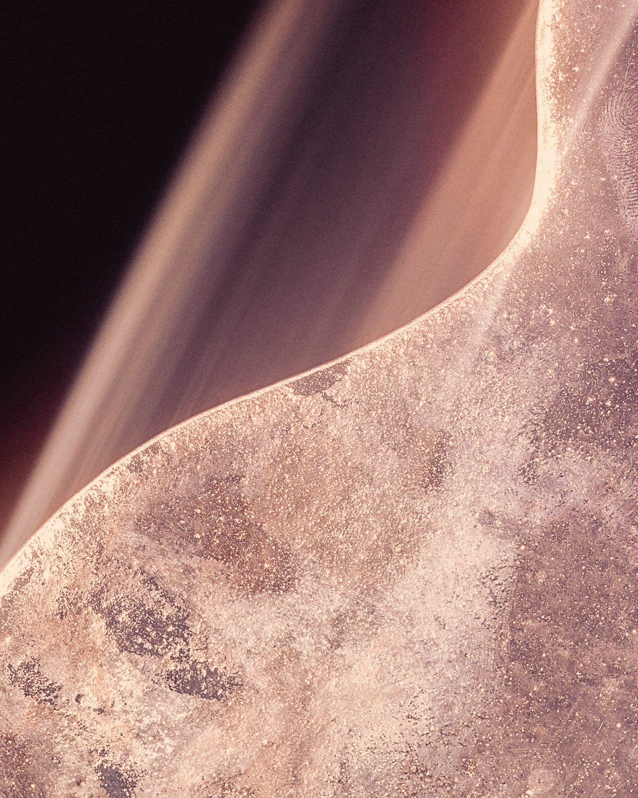 Light on a curving wave edge